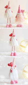 Detailed view of handmade Valentine gnome with heart embroidery and soft plush textures