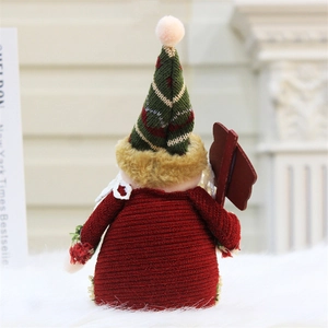 Rear view of festive Christmas gnome plush with red green striped hat and wood sign
