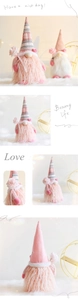 Detail of plush gnome doll with soft white beard holding pink roses for Valentine decor