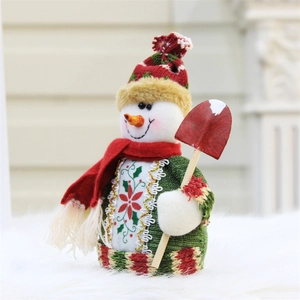 Detail view of 18cm plush snowman with knitted hat and red shovel for Christmas decor