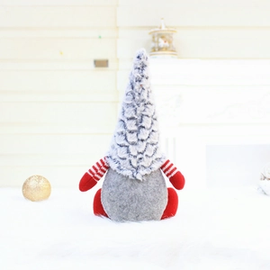 Handmade Christmas gnome plush with gray knit hat and red striped arms for home decor