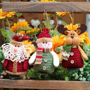 Set of three hanging Christmas plush figures including Santa, Snowman and Reindeer
