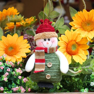 Knitted snowman Christmas ornament with red hat and green scarf for festive home decor
