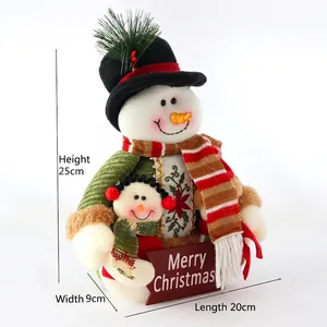 25cm Christmas snowman plush with Merry Christmas sign, red scarf and green sweater