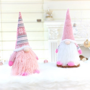 Set of pink Nordic Christmas gnomes with knit hats and plush beards for holiday decor