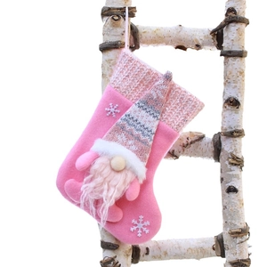 Pink Christmas stocking with gnome and sequins on a birch ladder decoration