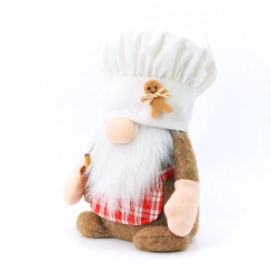 Detail of chef gnome plush with white hat and gingerbread man accessory for Christmas