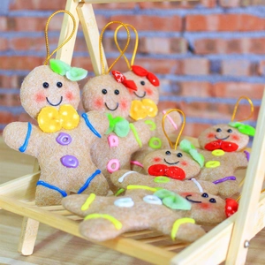 Christmas gingerbread man felt ornaments set with colorful embroidery for holiday decoration