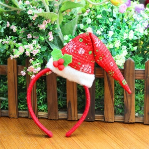Christmas headband with tall red Santa hat featuring snowflake pattern and holly berries
