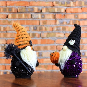 Handmade Halloween gnomes with sequins and striped hats for festive home decoration