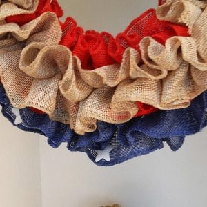 Patriotic July 4th burlap wreath with red blue and tan ruffles and white stars