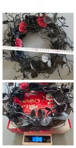 Halloween wreath size and weight check with black roses and dried branches detail