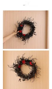 Close-up of gothic Halloween wreath with black twigs and dark red roses on a wooden door