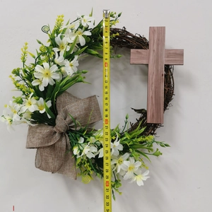 Detail shot of the Easter cross wreath showing 32cm height measurement with a tape