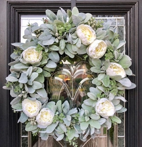 Close-up of artificial 30cm Easter wreath with white peonies and flocked green foliage