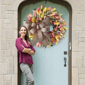 Vibrant artificial tulip wreath with a burlap bow for front door and wall decor