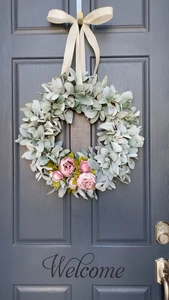 Detail of 30cm Easter wreath with faux sage green leaves and pink peony flowers on door