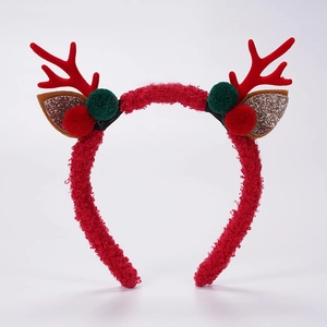 Détail du serre-tête bois de Noël rouge avec pompons verts et oreilles pailletées