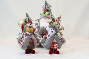 Detailed view of Santa, Reindeer, and Polar Bear plush figurines on snowflake bases