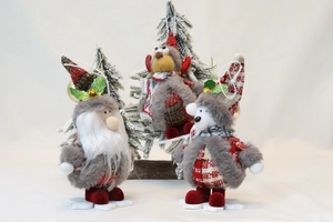 Macro view of Santa, Reindeer, and Bear plush ornaments with festive snowflake bases