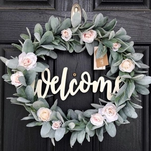 30cm Easter welcome wreath with pink roses and green foliage on a black wooden door