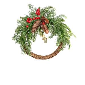Christmas wreath with natural pine cones, red berries and golden bells on rattan base
