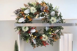 Detail showing the 45cm diameter of the autumn pumpkin and eucalyptus wreath