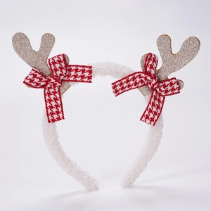 Détail du serre-tête de renne de Noël avec paillettes dorées et nœuds écossais