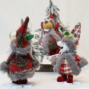 Three Christmas plush doll ornaments with red plaid fabric and wooden snowflake bases
