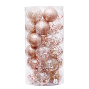 Rose gold Christmas ornament set with glitter and matte balls in clear cylinder packaging
