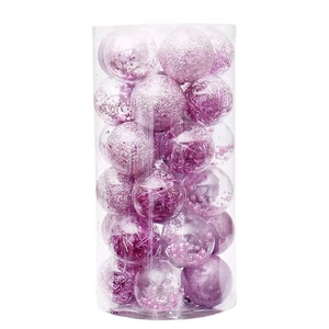 Set of decorative purple Christmas balls with glitter and sequins in a clear cylinder box