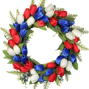 Close-up of red white and blue tulip wreath showing fabric textures and green fern leaves