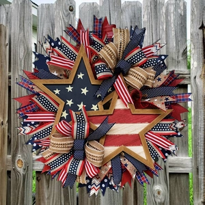 45cm Patriotic USA Flag Star Wreath with red white and blue ribbons on rustic wood