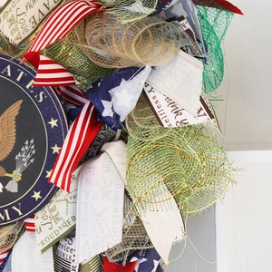 Patriotic Independence Day wreath with US Army eagle crest and red white blue ribbons