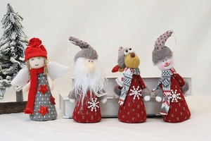 Detail of four knitted Christmas ornaments featuring Santa, reindeer, angel, and snowman