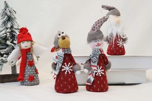 Close-up of four knitted Christmas plush dolls including Santa and Snowman decorations
