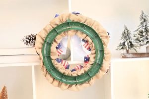 Detailed back view of patriotic wreath with green plastic frame and burlap fabric support