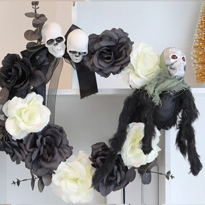 Detail of Halloween wreath featuring black and white roses with small skull accents