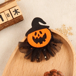 Halloween pumpkin hair clip with wizard hat and gold sequin mesh in festive setting