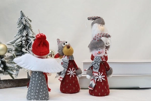 Detail of Christmas plush doll set featuring reindeer and snowman with knitted textures