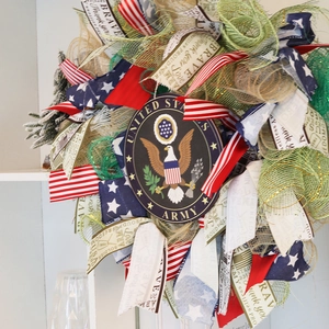 Patriotic United States Army wreath decoration with camo ribbons and US flag motifs