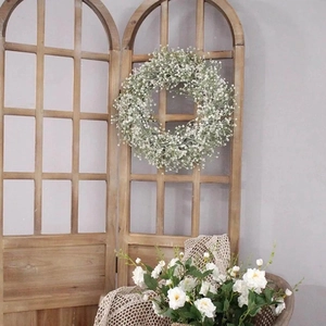 Rustic 40cm white baby's breath floral wreath hanging on a vintage wooden window frame