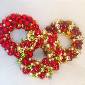 Detailed close-up of colorful Christmas ball wreaths featuring LED lights and shiny metallic tinsel