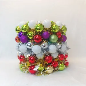 Macro detail of assorted Christmas decorative baubles with glitter, matte and shiny finishes