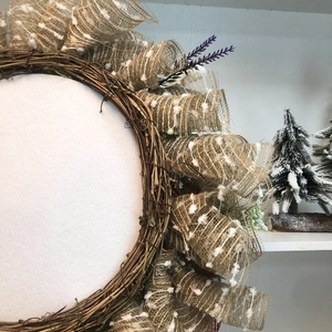Detail view of Highland Cow wreath showing natural rattan, linen ribbon and lavender accents
