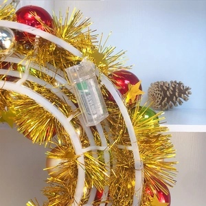 Detail view of the Christmas wreath battery box and wiring for LED illumination