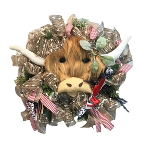 Handmade Highland Cow floral wreath with brown mesh ribbon and rustic spring decorations