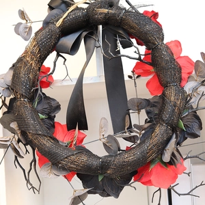 Gothic Halloween wreath with dark red roses, black branches and mesh for spooky decor