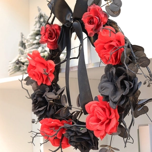 Halloween wreath with red and black faux roses, withered branches and ribbon bow decor