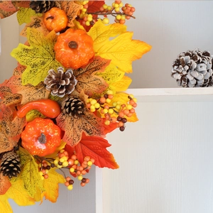 Autumn Thanksgiving wreath with faux pumpkins, maple leaves, and pine cones for home decor
